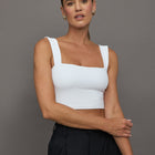 Model is wearing Square Neck Bra Top in White, front view.