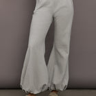 Model is wearing Boyfriend Puff Jog Pant in Light Heather Grey, front view.