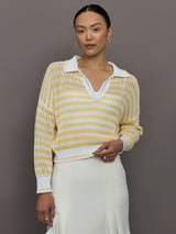 Model wears a lightweight collared open knit yellow and white striped sweater. 