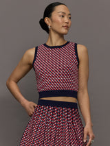 Model wears a red and blue patterned cropped tennis tank.