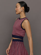 Model wears a red and blue patterned cropped tennis tank.