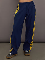 Front view of the Miaou pant in collegiate navy featuring a high rise elastic waistband and contrast stripe accents.
