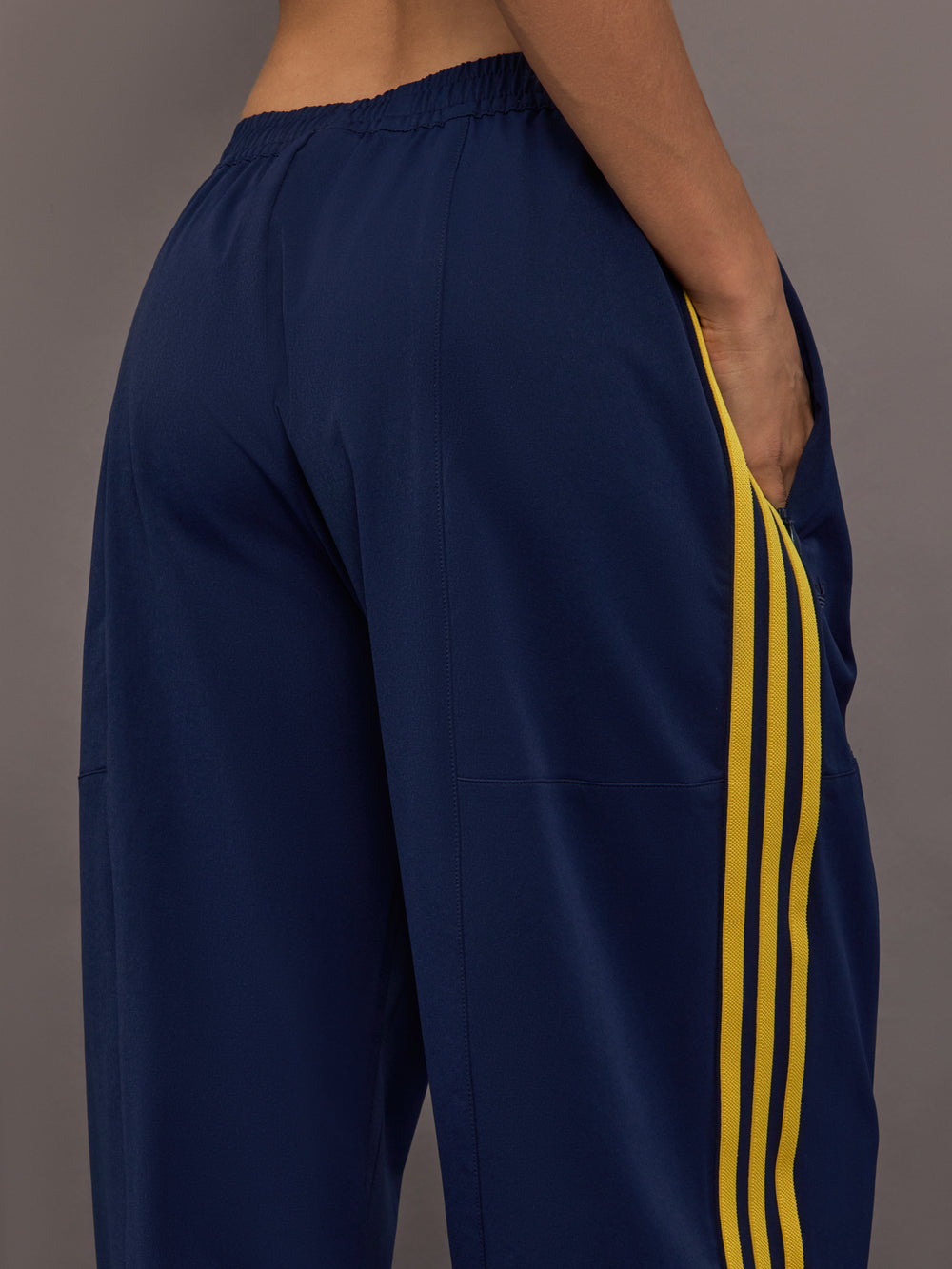 Detail view of the Miaou pant in collegiate navy highlighting the side pocket and contrast stripe construction.