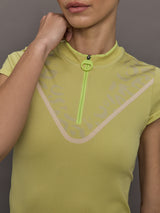 Model wears a short sleeve zip up activewear yellow/gold polo. 