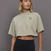 Model wears cropped t-shirt with a boxy fit, dropped shoulders, and a mock neck.





