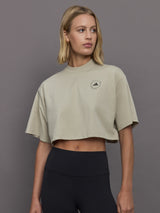 Model wears cropped t-shirt with a boxy fit, dropped shoulders, and a mock neck.




