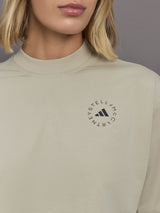 Model wears cropped t-shirt with a boxy fit, dropped shoulders, and a mock neck.
