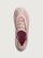 Sneakers in pink color with a biobased cage upper and lace-up closure.