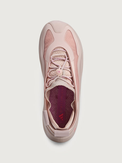 Sneakers in pink color with a biobased cage upper and lace-up closure.
