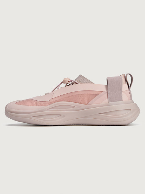 Sneakers in pink color with a biobased cage upper and lace-up closure.
