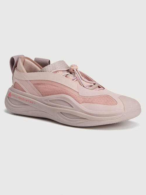 Sneakers in pink color with a biobased cage upper and lace-up closure.