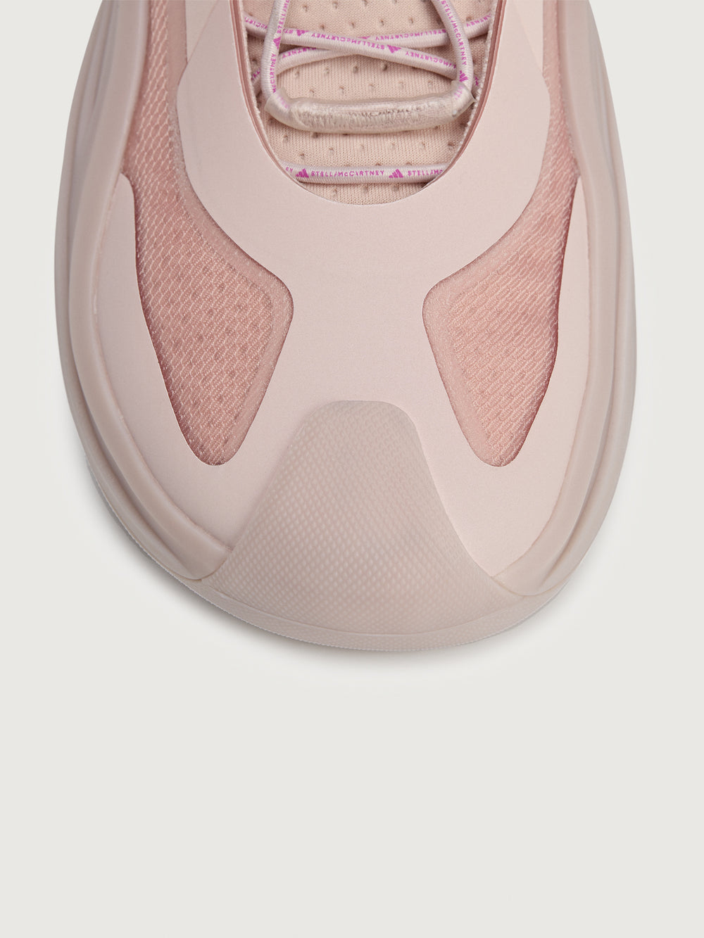 Sneakers in pink color with a biobased cage upper and lace-up closure.