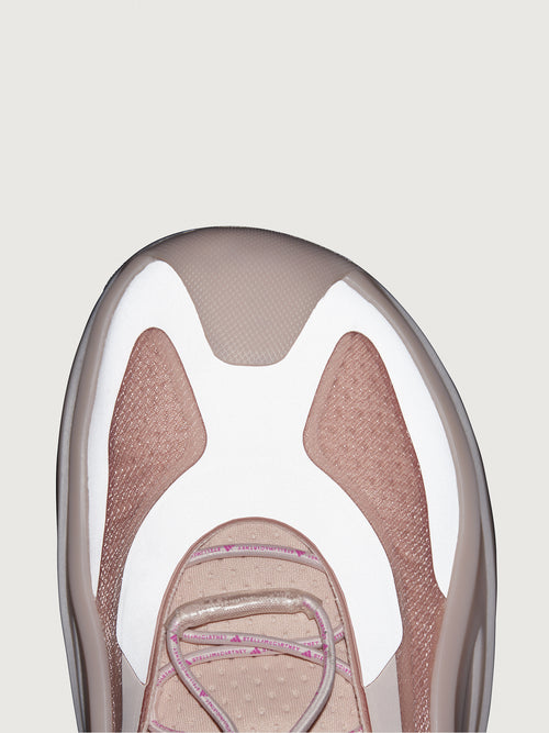 Sneakers in pink color with a biobased cage upper and lace-up closure.