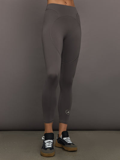 Model wearing gray leggings with a small logo.
