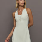 Model wearing a almond colored training dress.