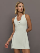 Model wearing a almond colored training dress.