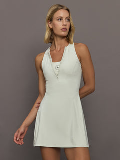 Model wearing a almond colored training dress.