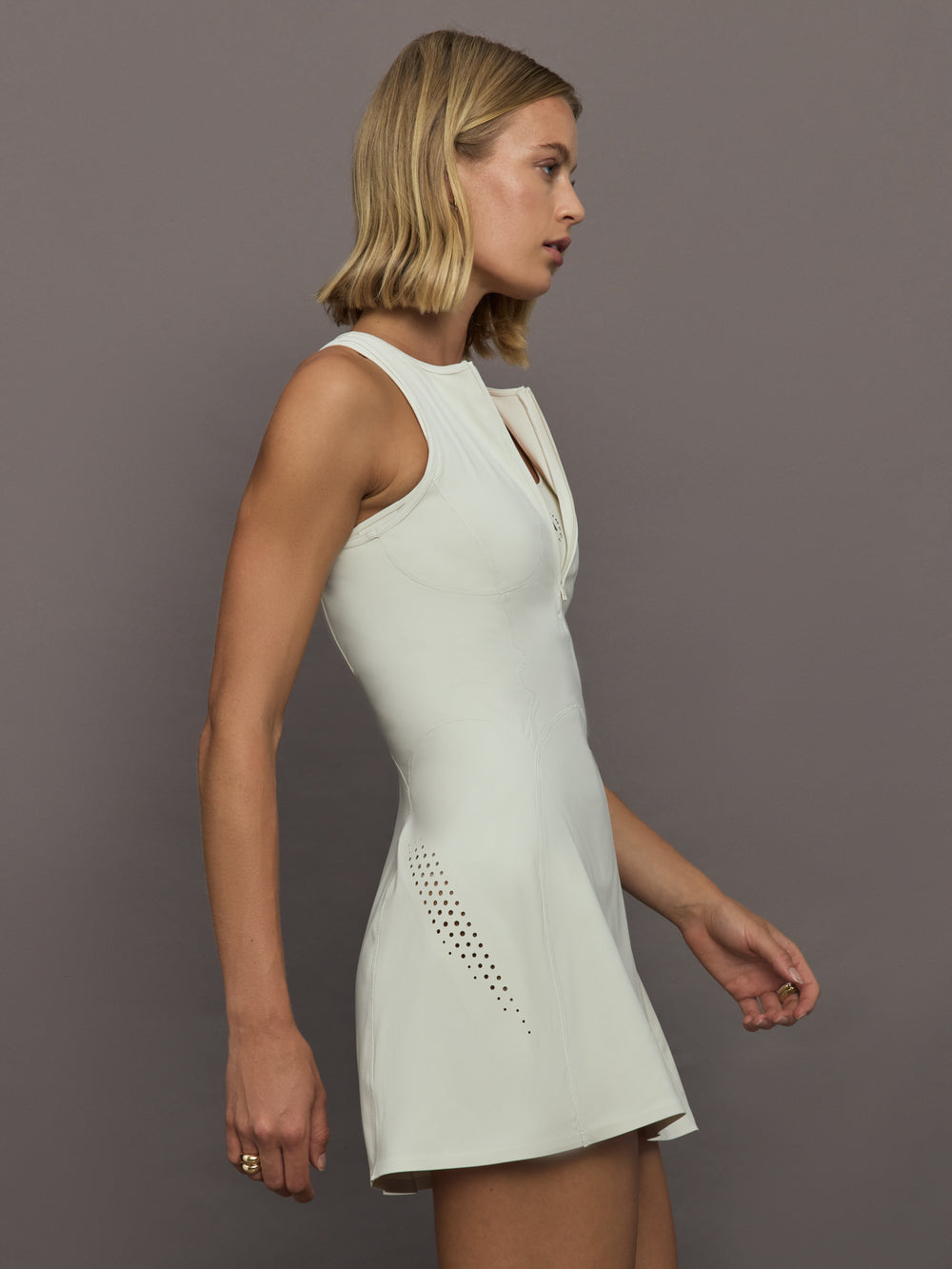 Model wearing a almond colored training dress.