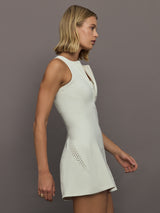 Model wearing a almond colored training dress.