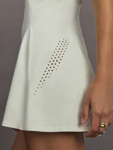 Model wearing a almond colored training dress.