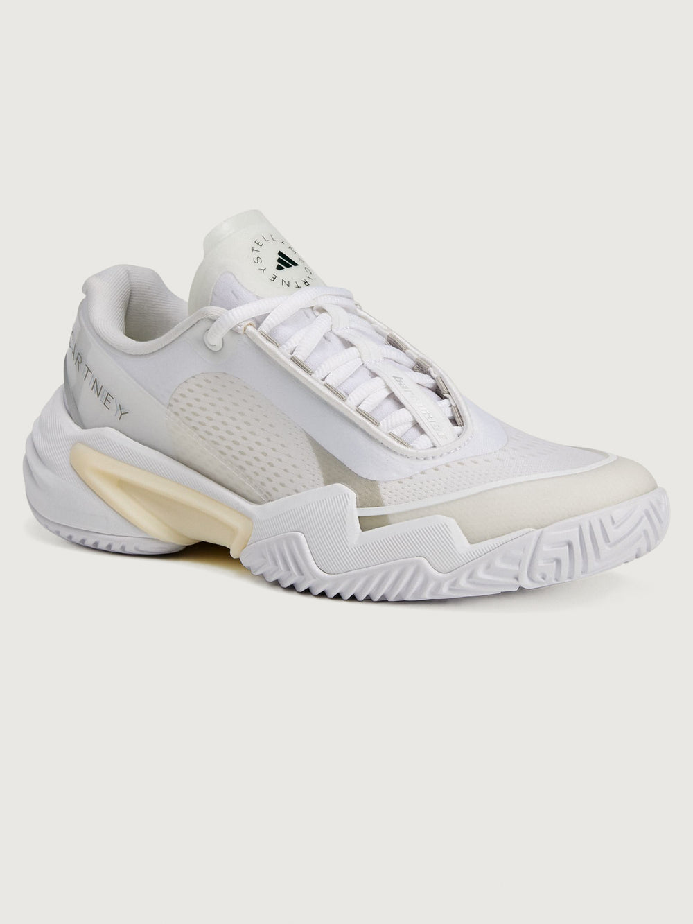 White sneaker with a brand logo on a white background