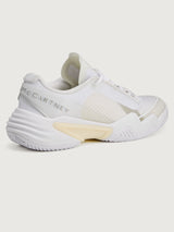 White sneaker with a brand logo on a white background