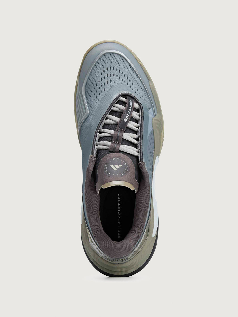 Gray and brown athletic shoe on a light gray background