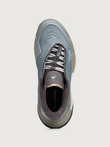Gray and brown athletic shoe on a light gray background