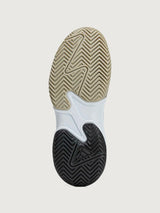 Close-up of a shoe sole with a textured pattern on a light gray background