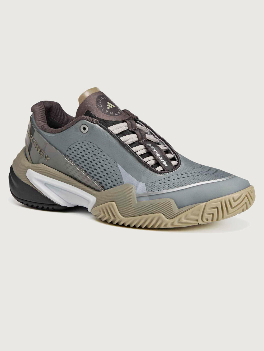 Gray and brown athletic shoe on a light gray background