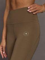 Brown leggings with a logo on a gray background