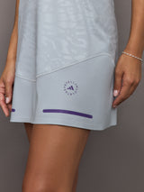 Gray athletic skirt with a brand logo on a gray background