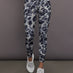 Model is wearing Training Interlock High-Waisted 7/8 Legging in Wonder Alumina/Black, front leg detail view.