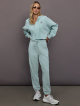 Model is wearing Sportswear Cropped Zip Hoodie in Vapour Green, full body styling.