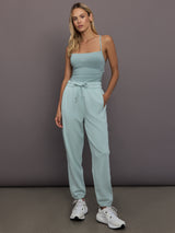 Model is wearing Sportswear Regular Sweatpant in Vapour Green, full body styling.