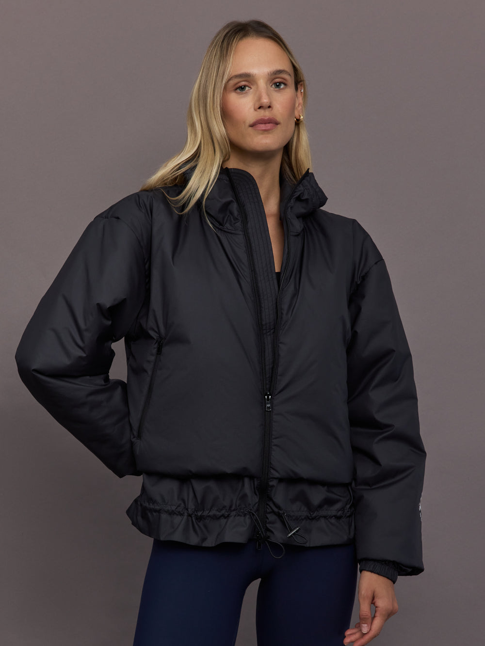 Model is wearing Liner Water-Resistant Jacket in black, front view.