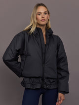 Model is wearing Liner Water-Resistant Jacket in black, front view.