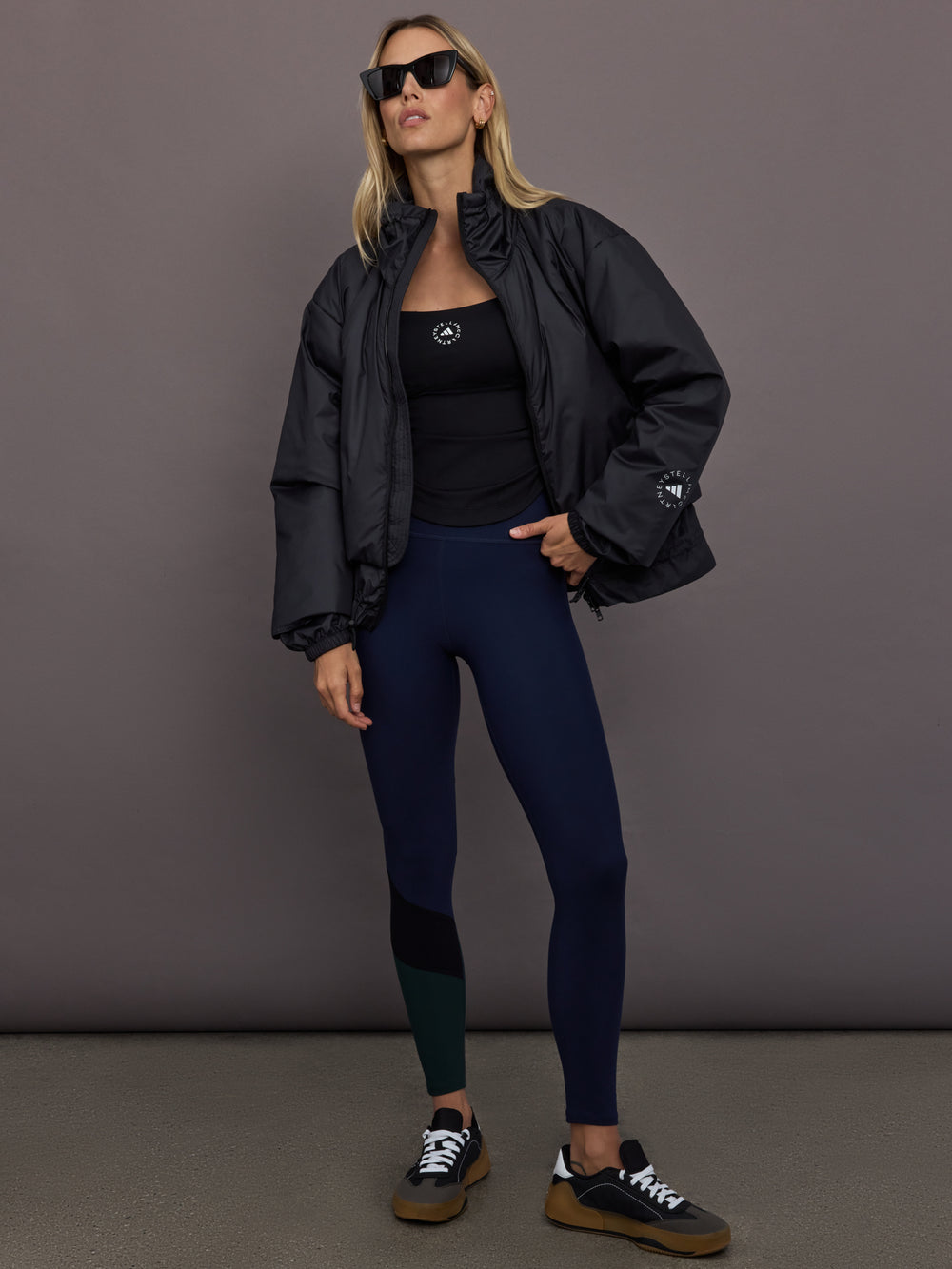 Model is wearing Liner Water-Resistant Jacket in black, full body styling.