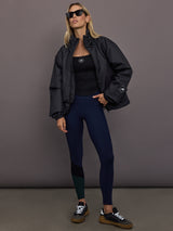 Model is wearing Liner Water-Resistant Jacket in black, full body styling.
