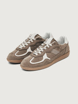 Brown sneaker with white accents.