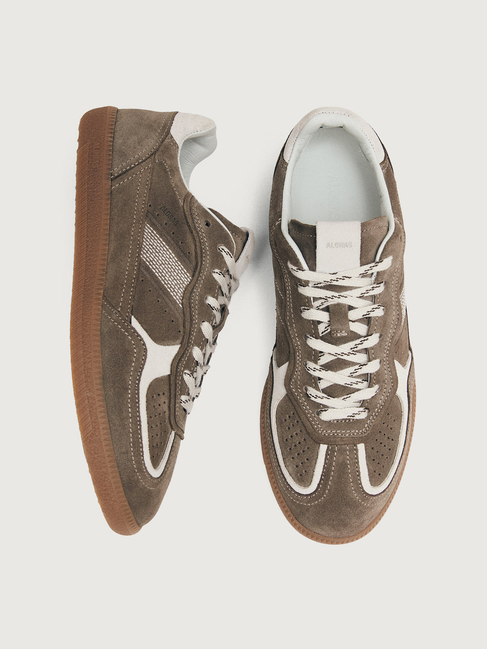 Brown sneaker with white accents.