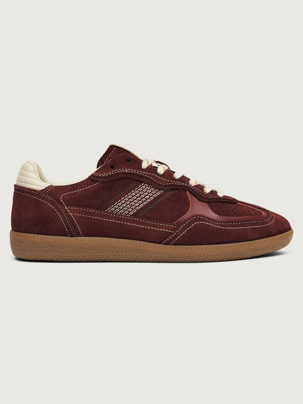 Burgundy sneakers with beige accents.