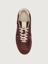 Burgundy sneakers with beige accents.