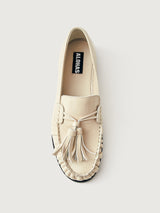 Beige loafer with tassel and black sole. 
