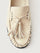 Beige loafer with tassel and black sole. 