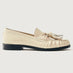 Beige loafer with tassel and black sole. 