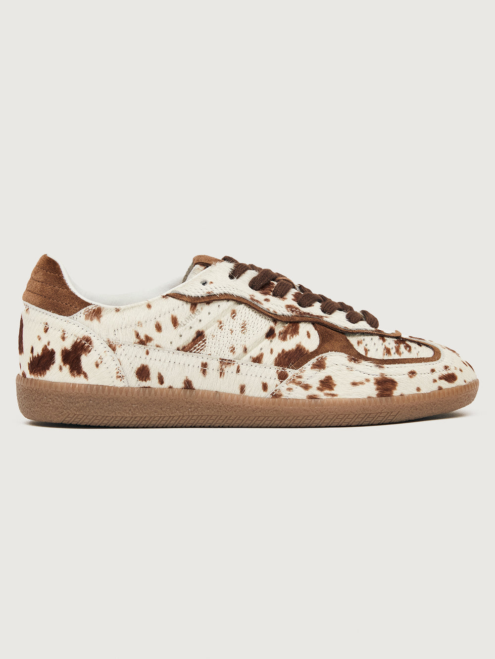 Cowhair creme colored shoe with brown cow print and suede brown heel detailing. 
