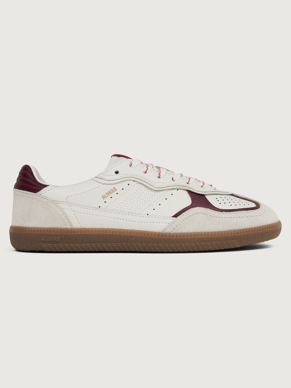 White sneaker with maroon accents.