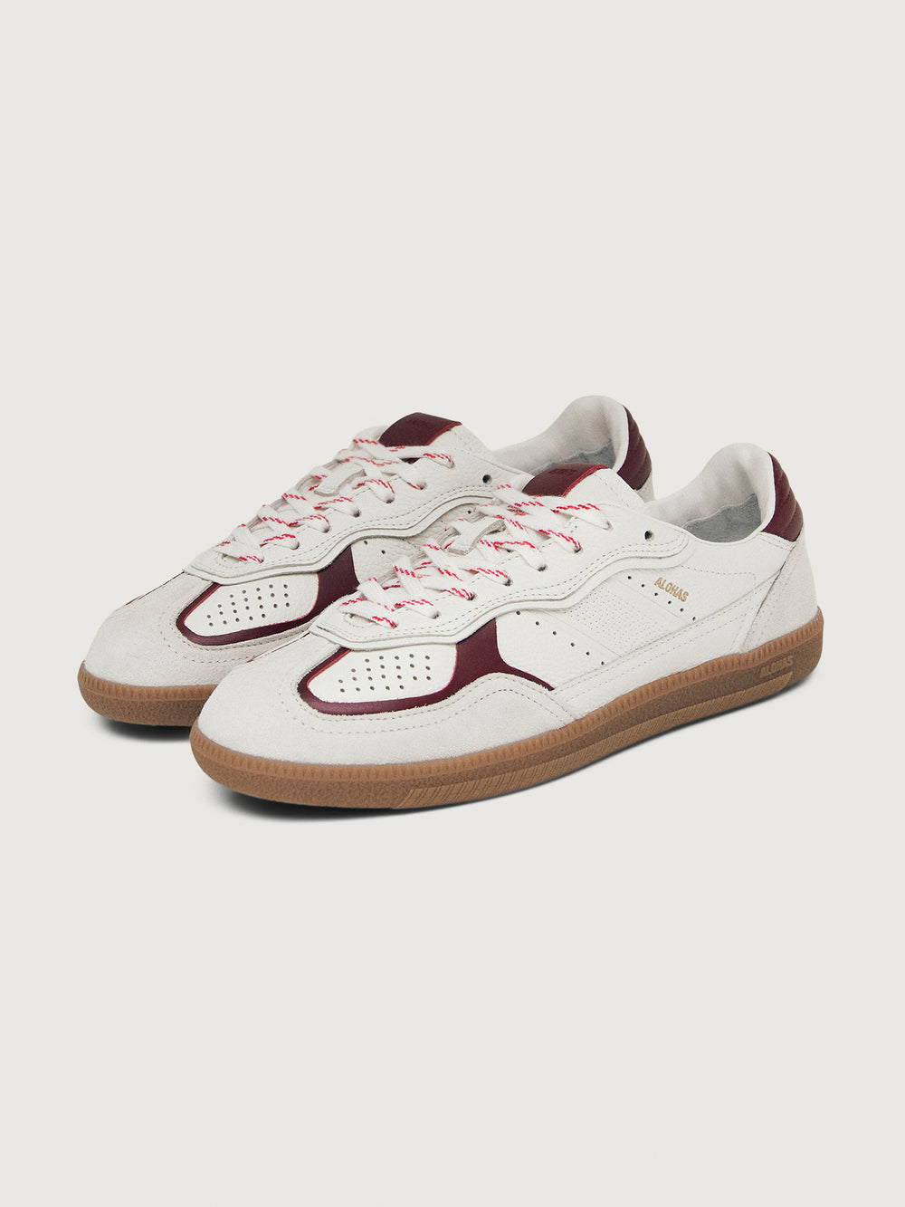 White sneaker with maroon accents.