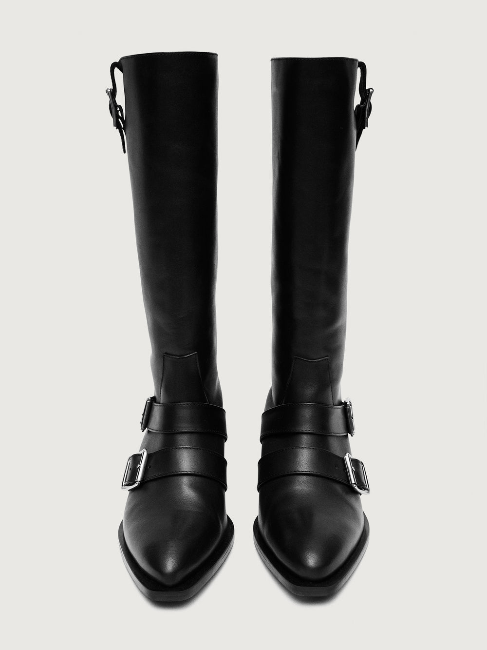 Black knee-high boot with silver buckles.
